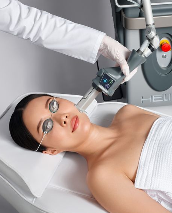 Helix and Coolpeel treatments being done on woman patient in lightly lit room-1