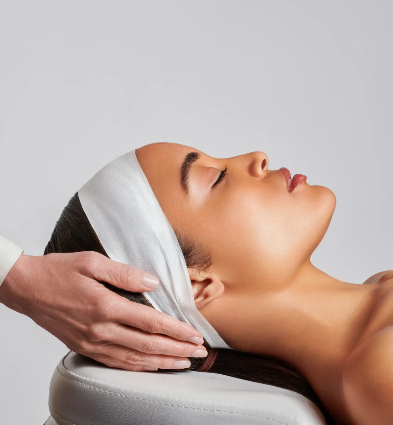 Woman-with-headband-preparing-for-microneedling-treatment