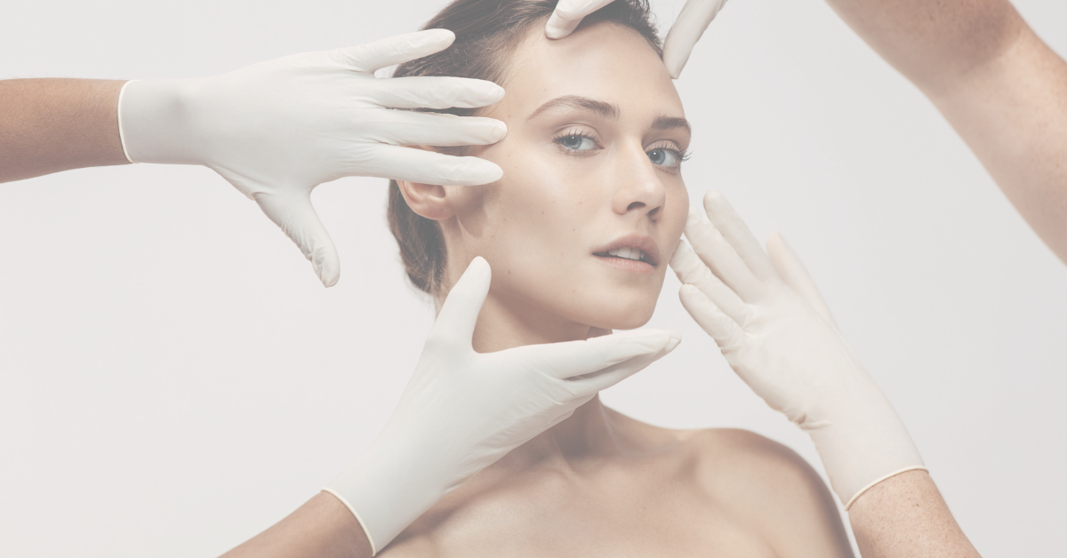 women's face being touched by gloves for aesthetic treatment