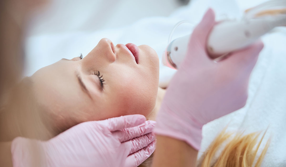 woman getting microneedling treatment