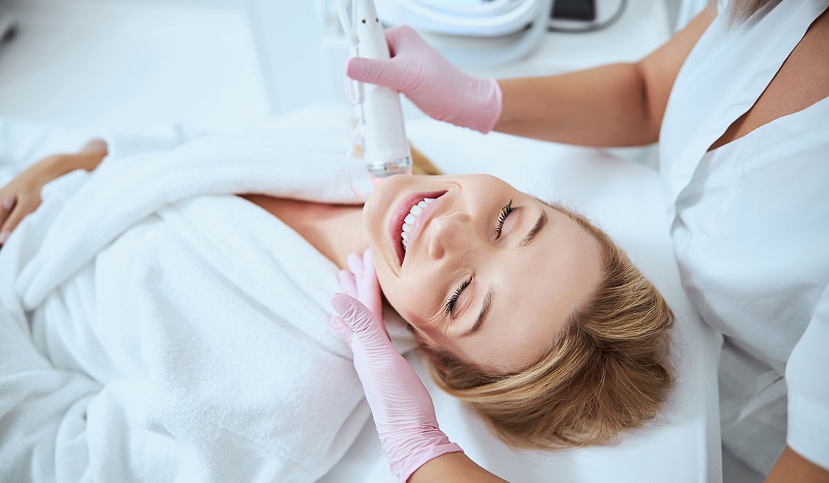 woman receiving microneedling procedure